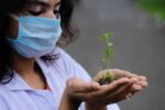 woman holding seedling